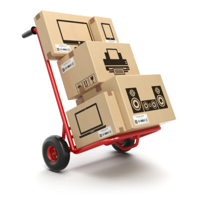 Sale and delivery of computer technics concept. Hand truck and cardboard boxes with PC, laptop, computer monitor and printer isoolated on white. 3d illustration